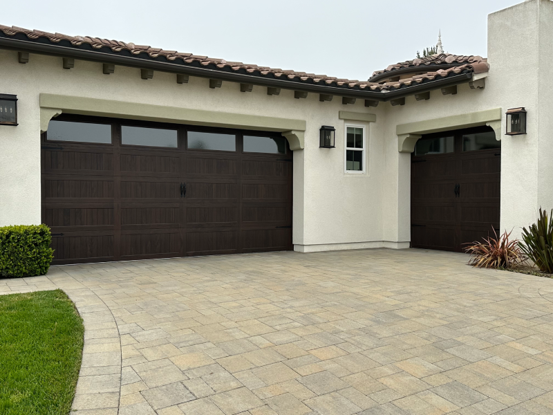 C.H.I. Stamped Carriage House Long Panel in the Walnut Accent Woodtone and Oversized Insulated Seeded Glass Windows Blue Ridge Decorative Hardware
