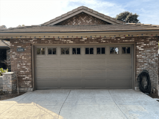 Walnut-finish steel garage doors and garage door openers installed in Woodland Hills by Archway Garage Doors for a professional, durable design.